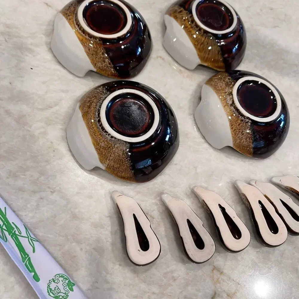 Vintage pottery Japanese fish shaped dishes and chopstick rests